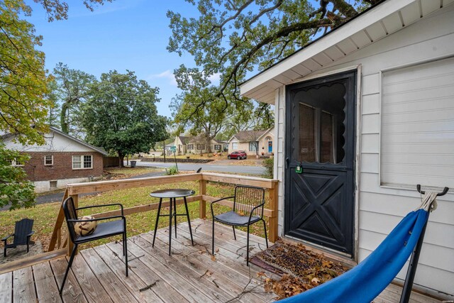 wooden deck with a residential view