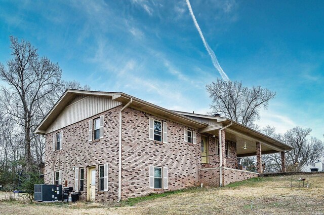 view of side of home featuring cooling unit