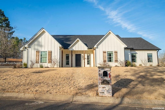 modern inspired farmhouse with board and batten siding and roof with shingles