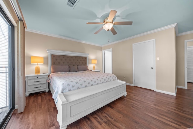 bedroom with dark wood-type flooring, visible vents, crown molding, and multiple windows