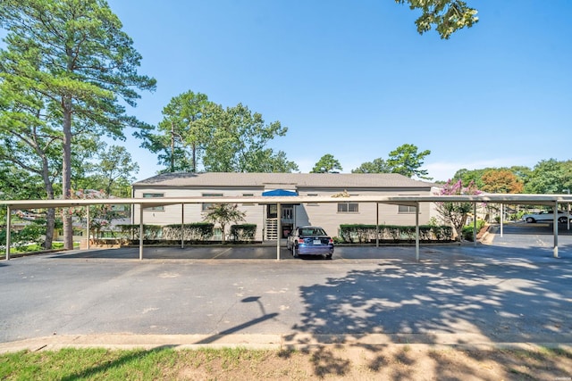 view of partially covered parking lot