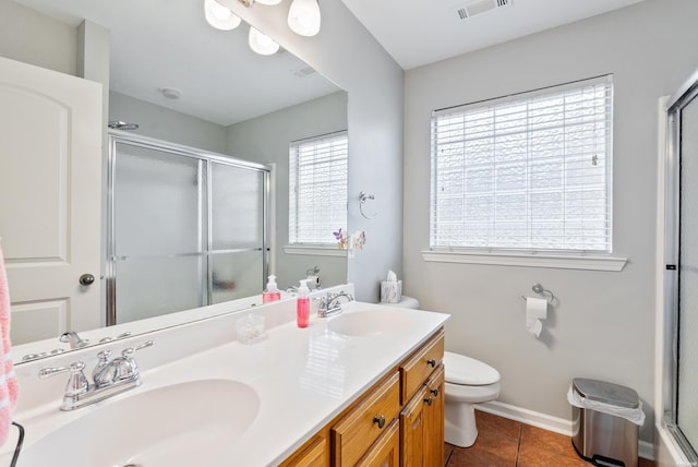 full bathroom with visible vents, toilet, an enclosed shower, a sink, and tile patterned flooring