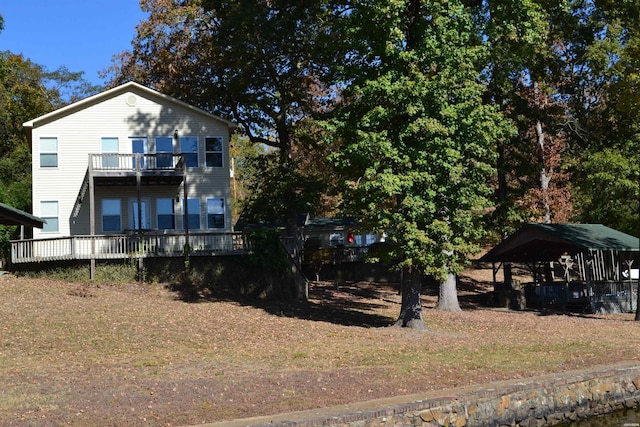 back of property featuring a balcony