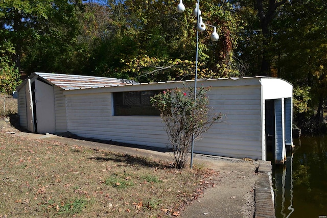 view of property exterior with metal roof