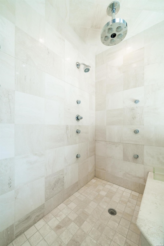 full bath featuring a tile shower