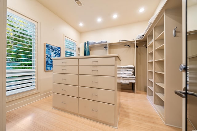 walk in closet with light wood-style floors and visible vents