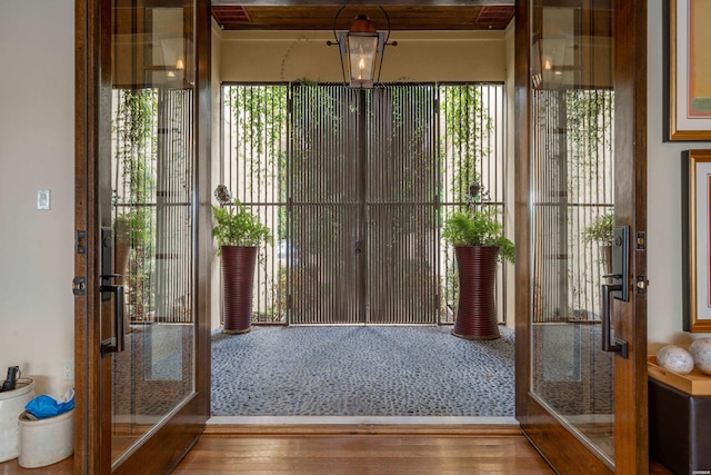 entryway with wood finished floors