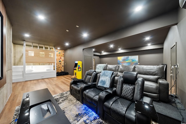 home theater room featuring wood finished floors and recessed lighting