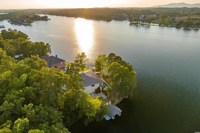 aerial view at dusk with a water view