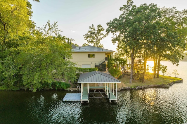 view of dock with a water view and boat lift