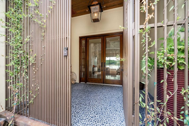 doorway to property with stucco siding and french doors