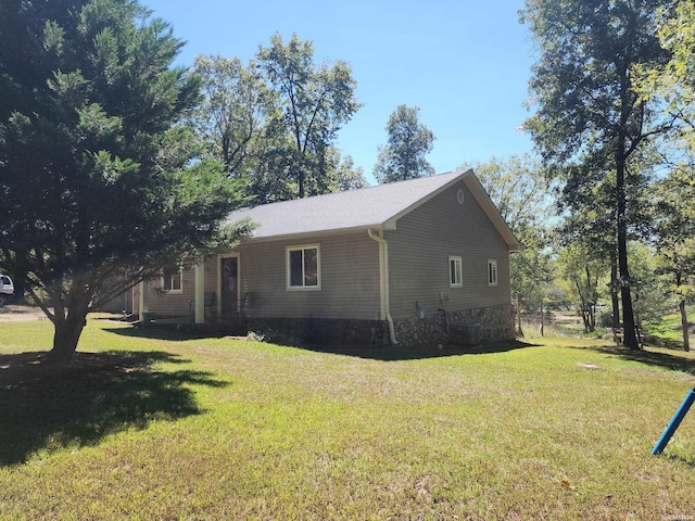 view of home's exterior featuring a yard