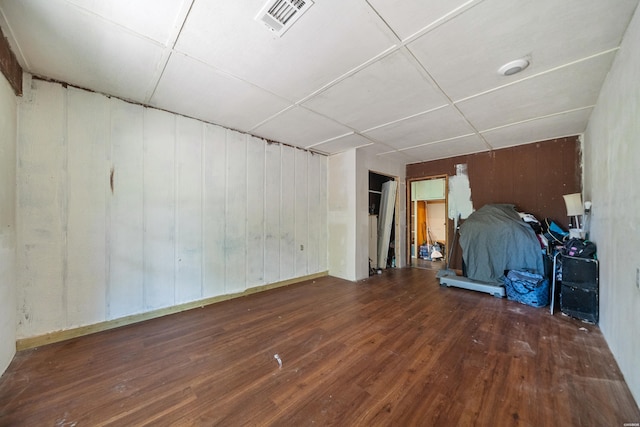 124 Primrose Ln, Pearcy, AR 71964 - unfurnished bedroom featuring hardwood / wood-style floors and wooden walls