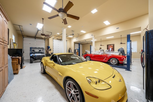 garage with a ceiling fan and freestanding refrigerator