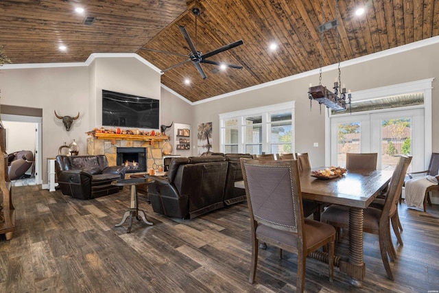 dining area featuring wooden ceiling, a warm lit fireplace, visible vents, and dark wood-style flooring