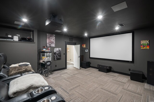 home theater room featuring baseboards, recessed lighting, visible vents, and light colored carpet