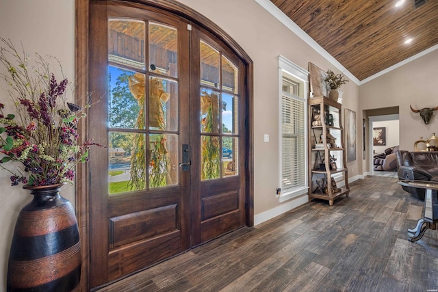 entrance foyer featuring dark wood-type flooring, wood ceiling, vaulted ceiling, ornamental molding, and french doors