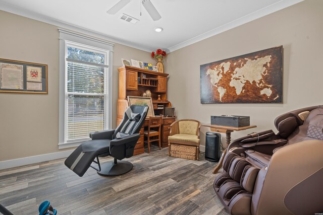 office area featuring baseboards, visible vents, a ceiling fan, dark wood-style floors, and crown molding