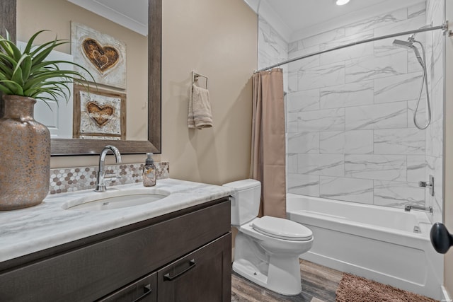 bathroom featuring crown molding, toilet, shower / bath combo, vanity, and wood finished floors