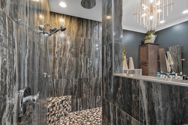 bathroom with ornamental molding, tiled shower, and recessed lighting