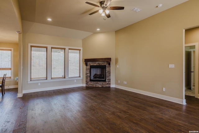 unfurnished living room featuring a ceiling fan, vaulted ceiling, baseboards, and dark wood-style floors