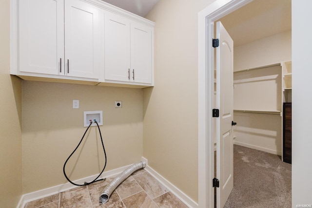 laundry room with cabinet space, hookup for a washing machine, baseboards, and electric dryer hookup