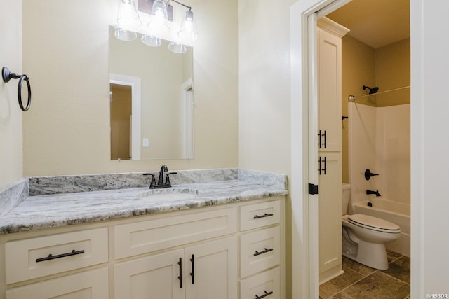 full bathroom featuring toilet, bathtub / shower combination, and vanity