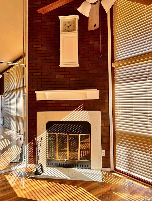 room details featuring wood finished floors and a fireplace with flush hearth