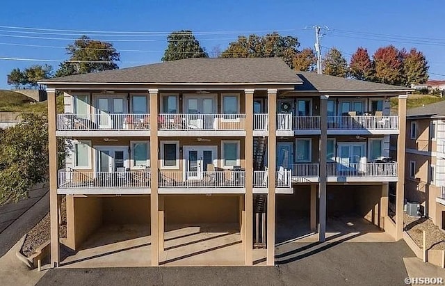 141 Central Ter Unit D, Hot Springs, AR 71913 - back of property with a shingled roof, french doors, driveway, and a balcony