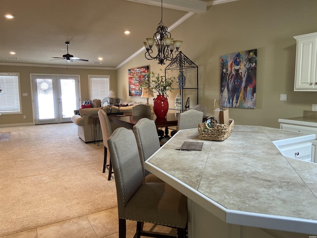 141 Central Ter Unit D, Hot Springs, AR 71913 - dining room featuring light carpet, light tile patterned floors, ornamental molding, vaulted ceiling, and french doors