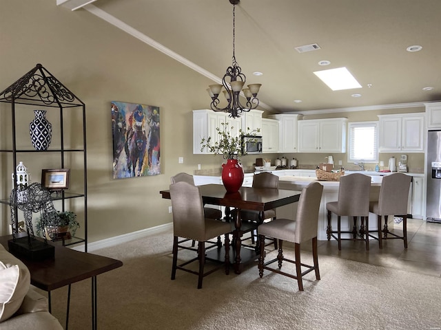 141 Central Ter Unit D, Hot Springs, AR 71913 - carpeted dining area with visible vents, ornamental molding, vaulted ceiling, a chandelier, and baseboards