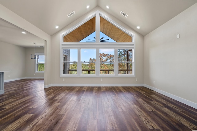 unfurnished living room with baseboards, visible vents, vaulted ceiling, and dark wood-style flooring