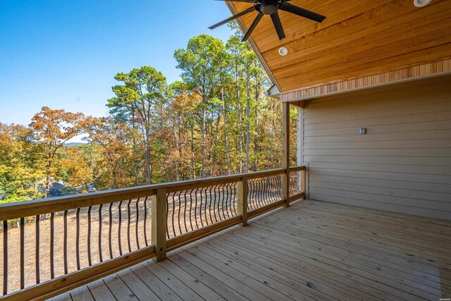 wooden deck featuring a ceiling fan