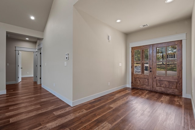 foyer with dark wood-style floors, baseboards, visible vents, and recessed lighting