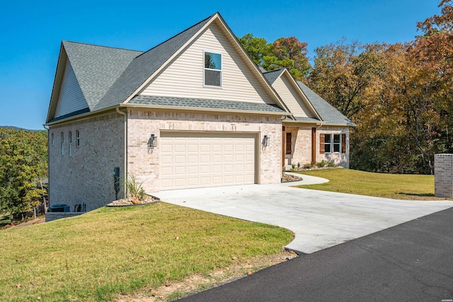 view of front of property featuring a garage, brick siding, driveway, roof with shingles, and a front lawn