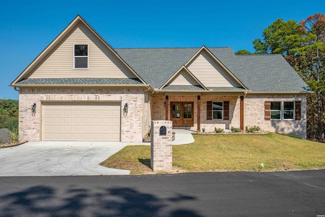 view of front facade with a garage, driveway, a front lawn, and roof with shingles