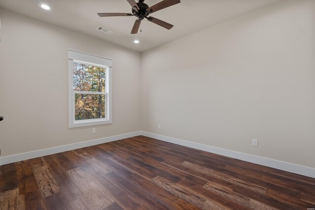 empty room with recessed lighting, a ceiling fan, visible vents, baseboards, and dark wood-style floors