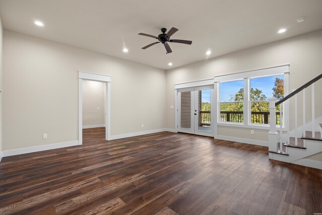 unfurnished living room with stairs, dark wood-type flooring, baseboards, and recessed lighting