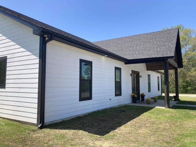 197 Country View Trl, Pearcy, AR 71964 - view of side of property featuring a lawn, a patio area, and roof with shingles