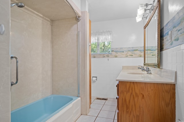 bathroom with wainscoting, vanity, tile walls, and tile patterned floors