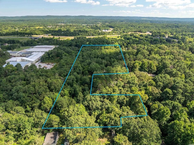 aerial view featuring a view of trees