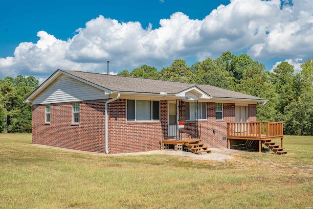 ranch-style home with a front yard, brick siding, and a shingled roof