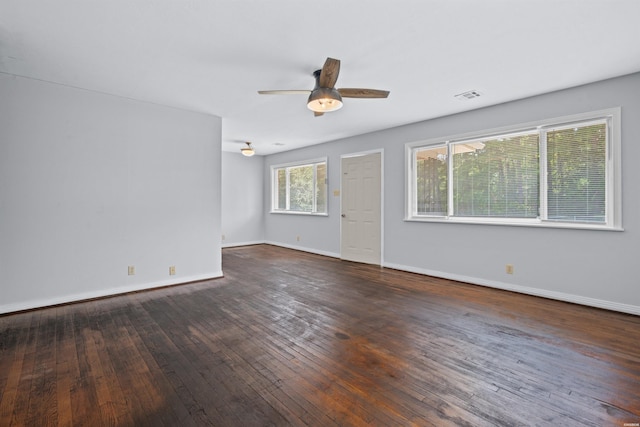 empty room with visible vents, baseboards, ceiling fan, and hardwood / wood-style flooring