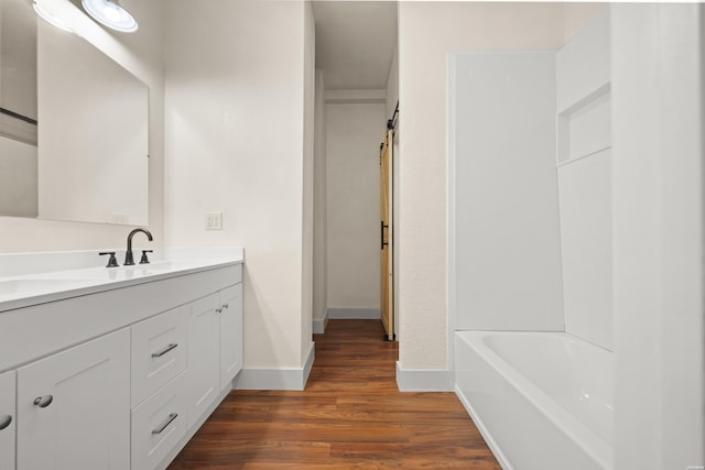 301 Walter St, Hot Springs, AR 71901 - full bath featuring wood finished floors, vanity, and baseboards