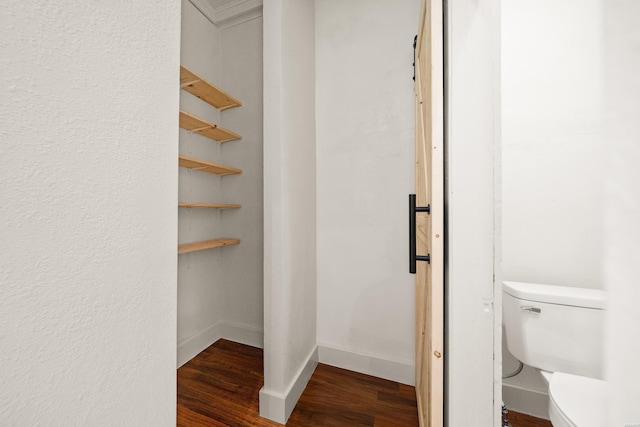 301 Walter St, Hot Springs, AR 71901 - bathroom featuring wood finished floors, toilet, and baseboards