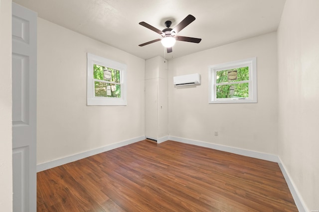 301 Walter St, Hot Springs, AR 71901 - unfurnished room featuring a wall unit AC, healthy amount of natural light, and wood finished floors
