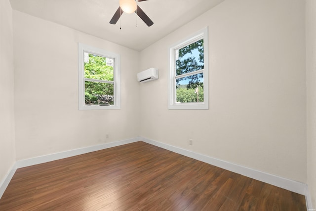 301 Walter St, Hot Springs, AR 71901 - spare room with a wall mounted AC, dark wood finished floors, baseboards, and ceiling fan