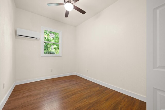 301 Walter St, Hot Springs, AR 71901 - empty room with an AC wall unit, dark wood-style flooring, and baseboards