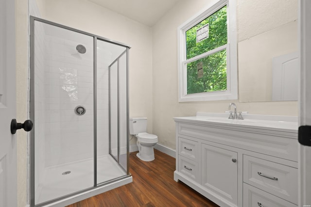 301 Walter St, Hot Springs, AR 71901 - bathroom with wood finished floors, a stall shower, vanity, toilet, and baseboards