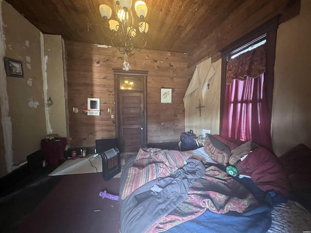 bedroom with a chandelier, wood ceiling, and wood walls